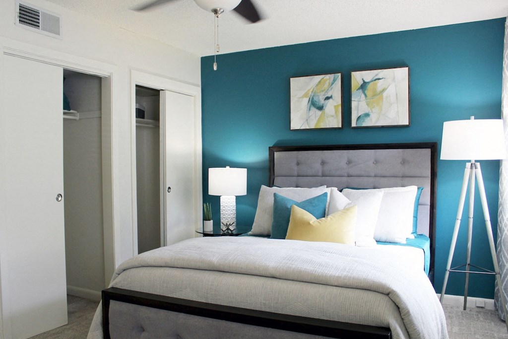 bedroom with double closet, fan, and plush carpeting  at Huntsville Landing Apartments, Alabama, 35806
