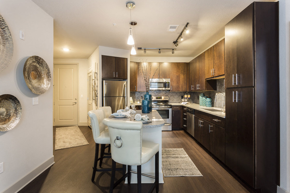 Kitchen with island and custom cabinetry  at LandonHouse Apartments in Lake Nona, Orlando, FL 32827