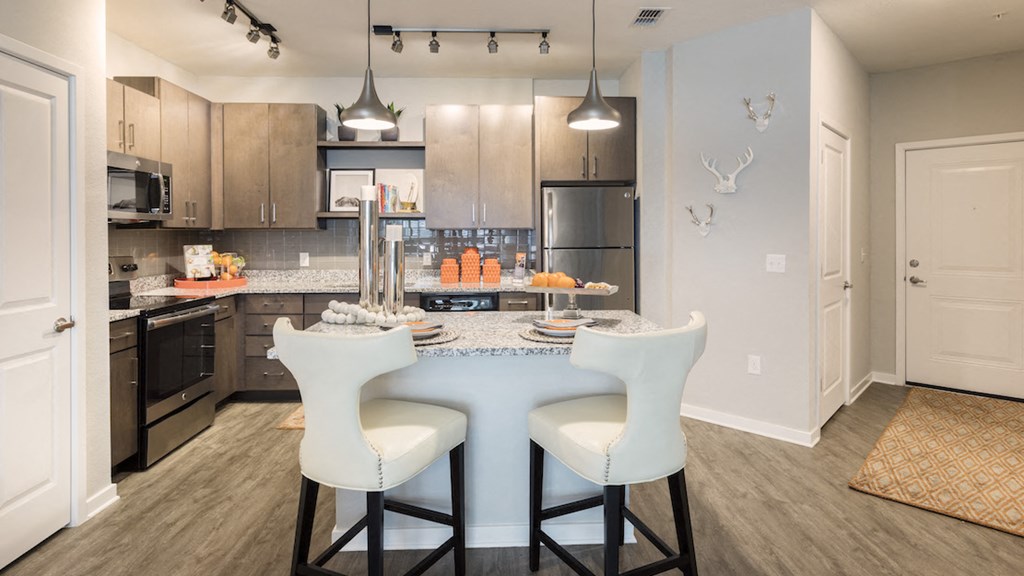 eat-in kitchen with pendant lighting over island