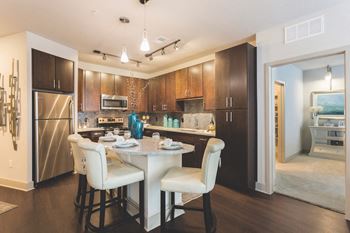 kitchen with track and pendant lighting at Landon House Apartments in Orlando, FL