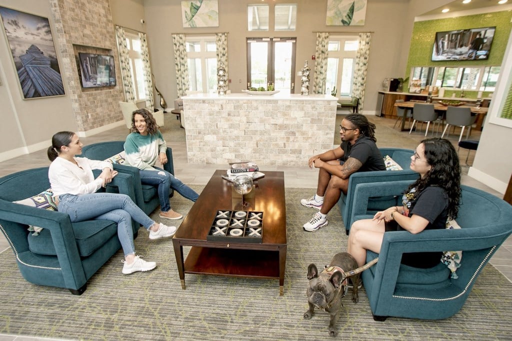 Residents sitting in lobby enjoying talking together
