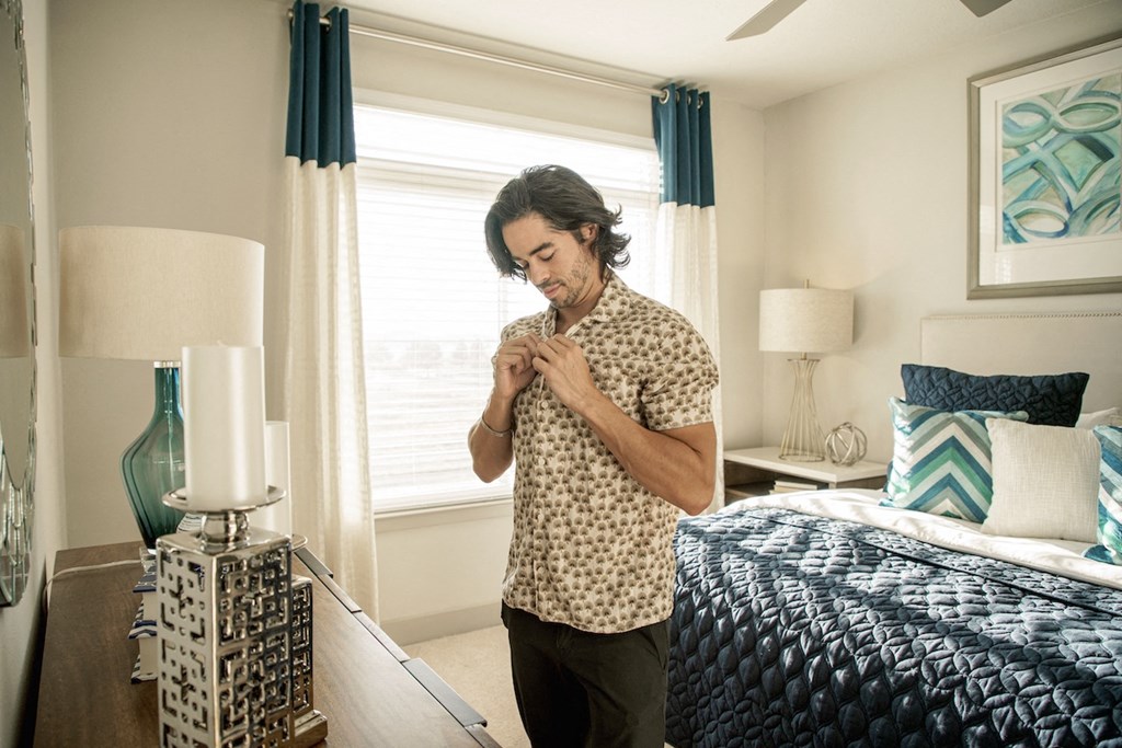 Man getting dressed in spacious bedroom at LandonHouse
