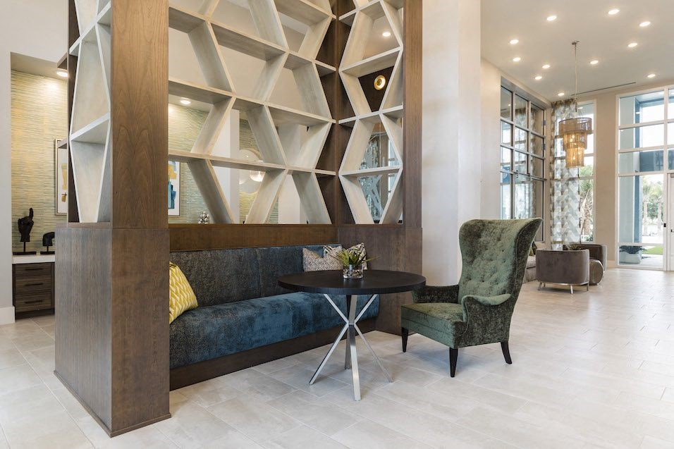sofa, chair, and table in lobby nook at Residences at The Green