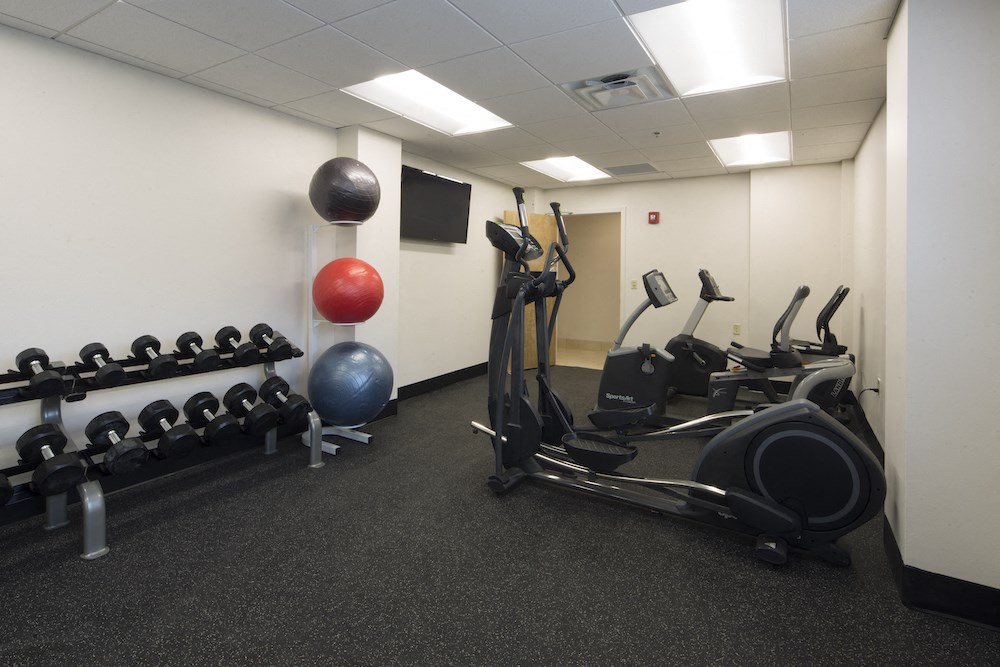 Mount Carmel Gardens senior apartments in jacksonville, florida fitness center with cardio and weight equipment