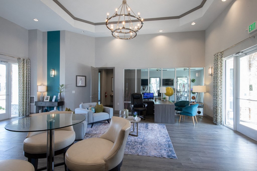 a living room with grey walls and a chandelier hanging from the ceiling  at The Madison Franklin, Franklin