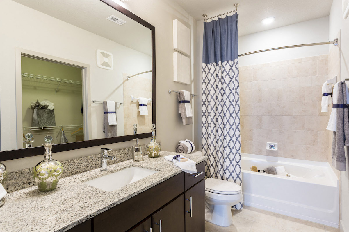 Master bath with tile and granite  at LandonHouse Apartments in Lake Nona, Orlando, FL 32827