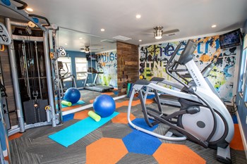 fitness center with cardio, strength, and yoga equipment at The Mills at 601, Alabama, 36066 - Photo Gallery 25