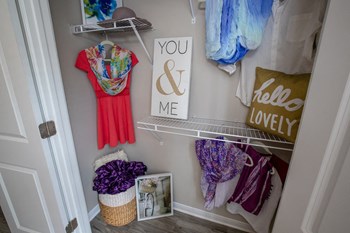 Large closet with built-in wire shelving and clothing hanging at The Mills at 601, Prattville - Photo Gallery 22