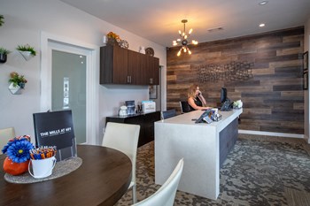 modern leasing office with large desk and helpful staff at The Mills at 601, Prattville, AL, 36066 - Photo Gallery 11