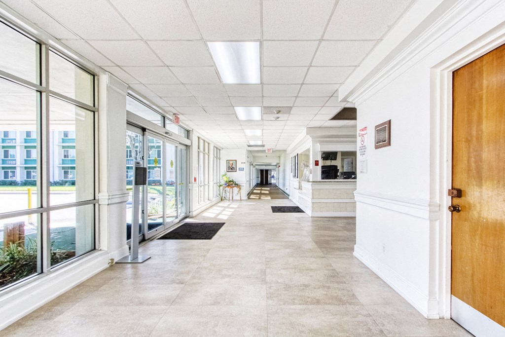 lobby entrance to Morris Manor with large windows and reception desk