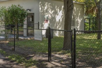 The fenced bark park for small dogs at The Terraces at Clearwater Beach Apartments