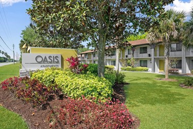 Monument Sign at The Oasis Apartments, Florida, 32114