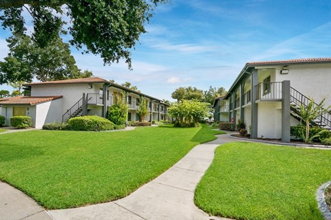 Lush Green Outdoors at The Oasis Apartments, Daytona Beach, FL