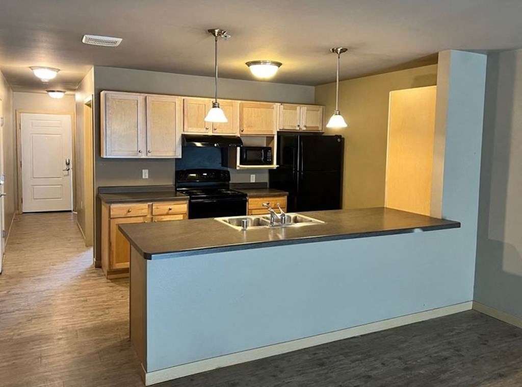 a fully equipped kitchen with ample cabinetry and counterspace at Pioneer Ridge in Wisconsin Dells