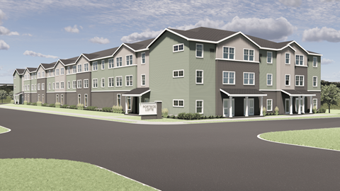 A modern apartment complex with a green and grey color scheme.