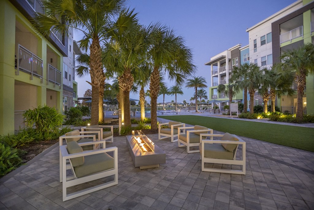 Fire pit lounge with ample seating by the green at Residencsa at The Green in Lakewood Ranch Bradenton