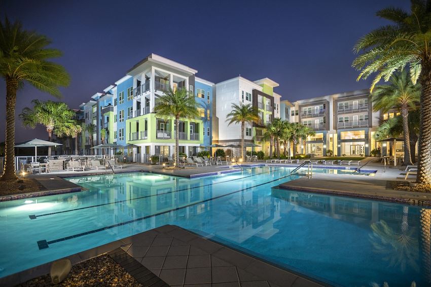 Residences-The-Green-PG-13 Luxury, resort-style, olympic-sized pool at night at Residences at The Green Apartments for rent - Photo Gallery