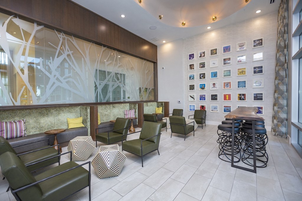 No business lounge with record albums on the wall and lounge seating at Residences at The Green