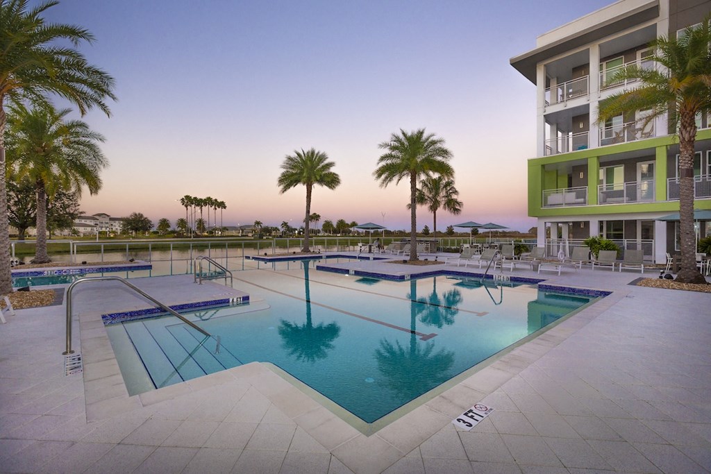The large, tranquil pool at Residences at The Green at dusk