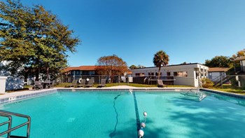 Large swimming pool Large swimming pool and sundeck at Reserve at Midtown Apartments in Tallahassee, Florida 32303 - Photo Gallery 2
