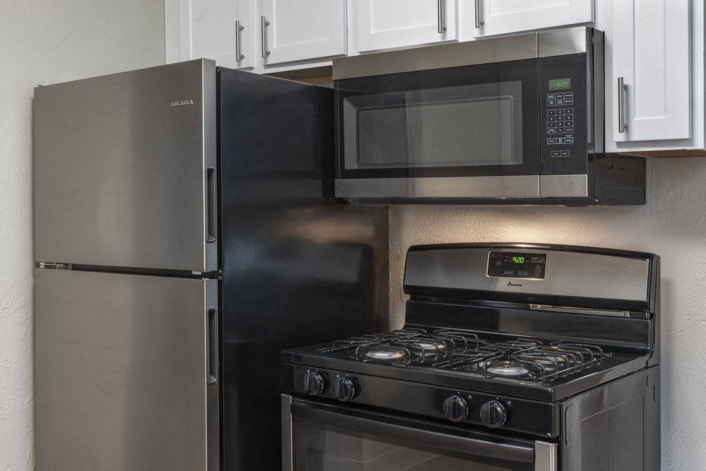 Stainless Steel appliance package with range, fridge and mounted microwave at Terraces at Clearwater Beach, Florida