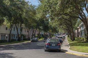 cars parked along the street in front of the residential buildings at Terraces at Clearwater Beach