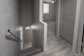 a staircase leading upstairs in a townhome style apartment at Terraces at Clearwater Beach