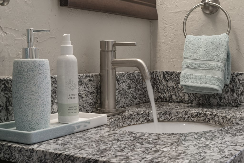 Granite countertop and modern fixture in bathroom  at Terraces at Clearwater Beach, Clearwater, Florida