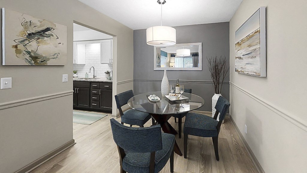 Dining area with pendant lighting, plank-style flooring, and model dining set at The Madison Franklin, Tennessee, 37064