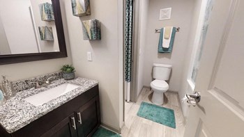 Bathroom2 bathroom with granite vanity, mirror, toilet, and tub - Photo Gallery 6