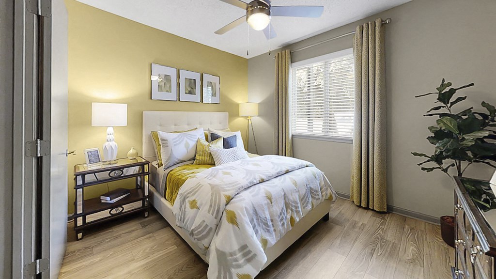 Bedroom with ceiling fan, large window, and plank-style flooring at The Madison Franklin, Tennessee, 37064