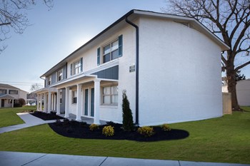 neat sidewalks, landscaping, and freshly painted residential buildings neat sidewalks, landscaping, and freshly painted residential buildings at The Kensington Apartments, Huntsville, AL, 35816 - Photo Gallery 2