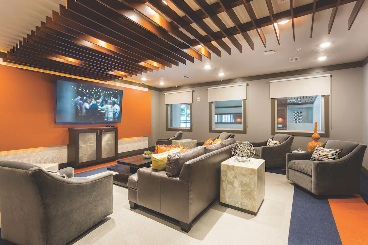 Theater room with couches and chairs  at LandonHouse in Lake Nona
