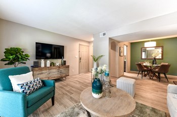 Berry-Living1 living room with hardwood-inspired flooring, model furnishings, and dining room - Photo Gallery 4