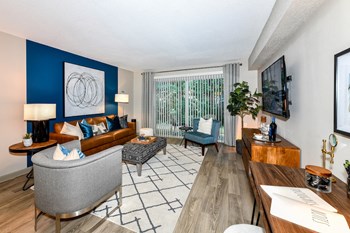Jameson-Livingroom2 living room with accent wall and sliding glass door to patio - Photo Gallery 4