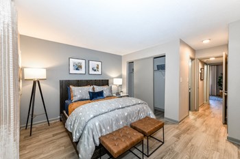 Jameson-Bedroom1 bedroom with hardwood-style flooring, closet, and model decor - Photo Gallery 5