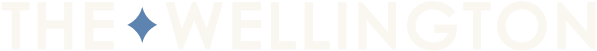 The Wellington logo with a blue diamond shape.