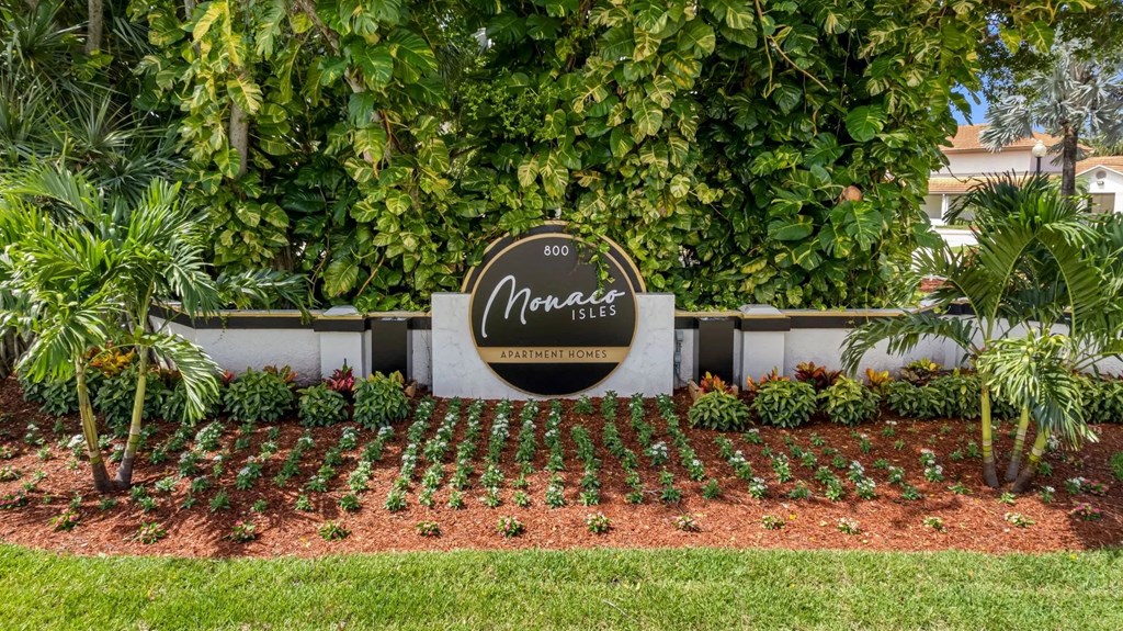 the sign is in front of the front yard of a house