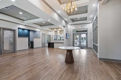 a large lobby with a round table in the center of it