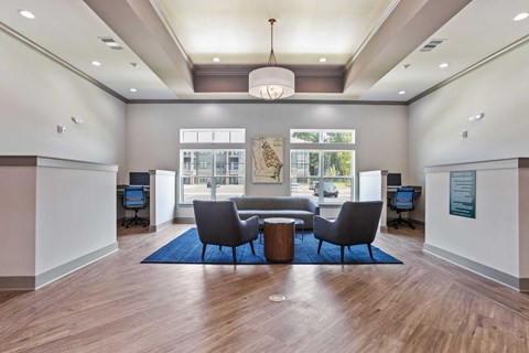 a conference room with a table and chairs in the middle