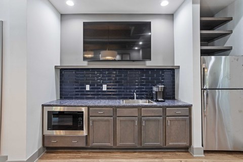a kitchen with a sink and a microwave