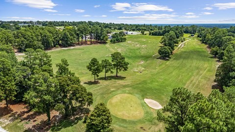 a view of the golf course from the air