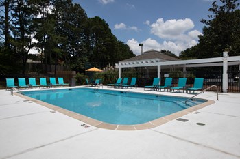 Zelda-Pointe-Gallery-10 large pool and spacious sundeck with lounge chairs and pergola area - Photo Gallery 4