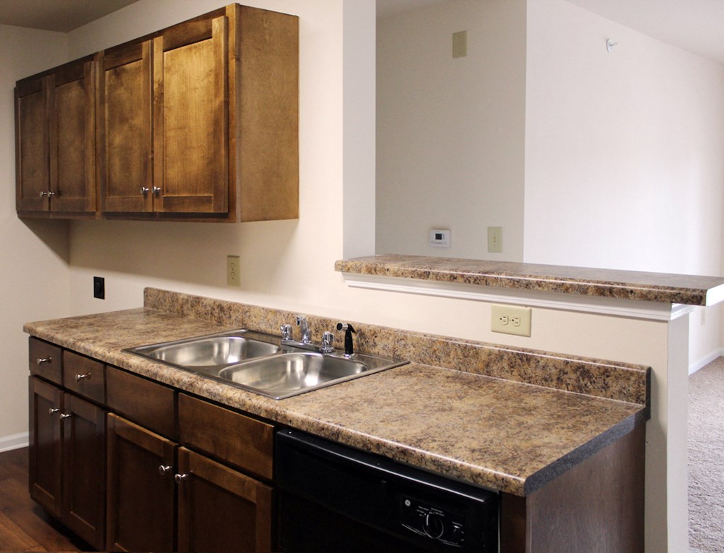 upgraded kitchen with stainless steel sink and granite look counters