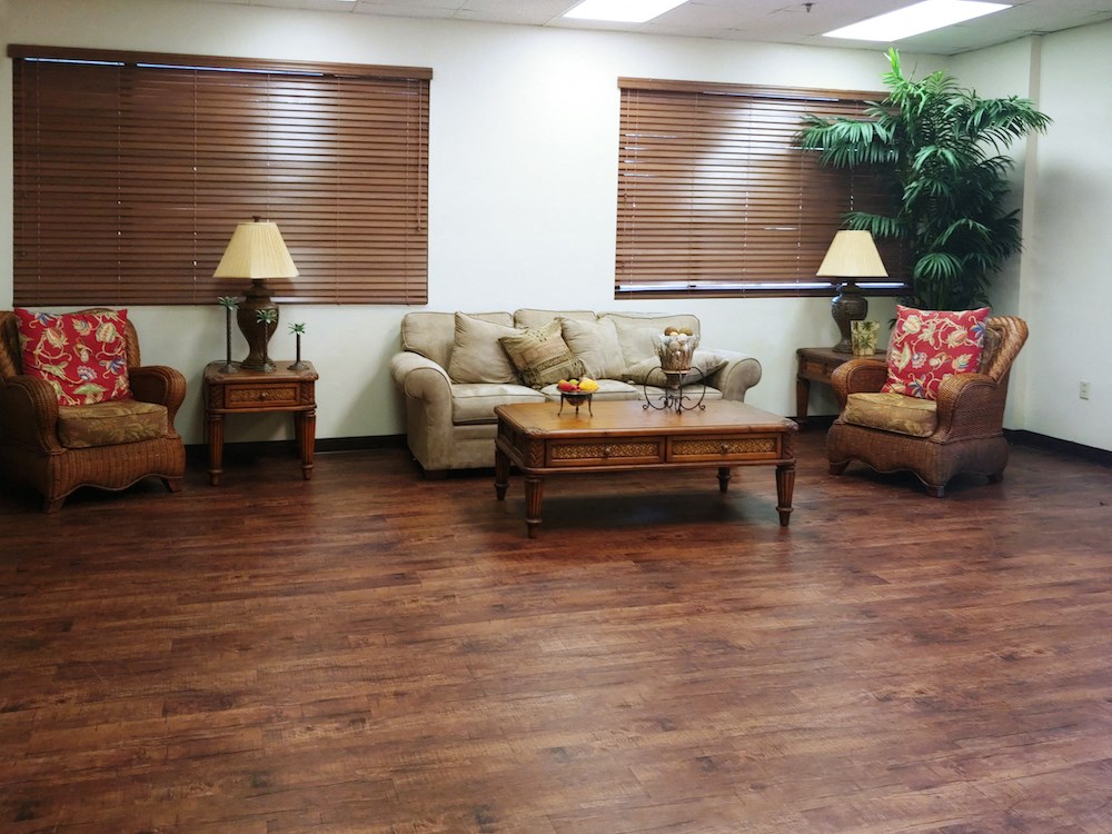 nice sitting area with couch, chairs, and lamps at B'nai B'rith I, II, & III apartments in deerfield beach