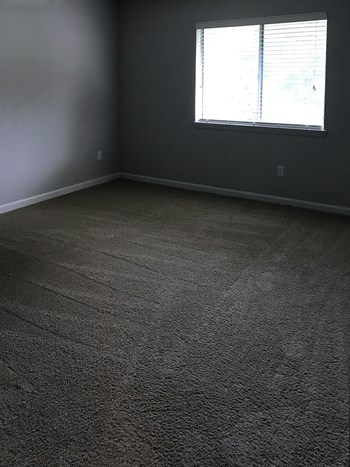swg-6 bedroom with large window and plush carpeting - Photo Gallery 6