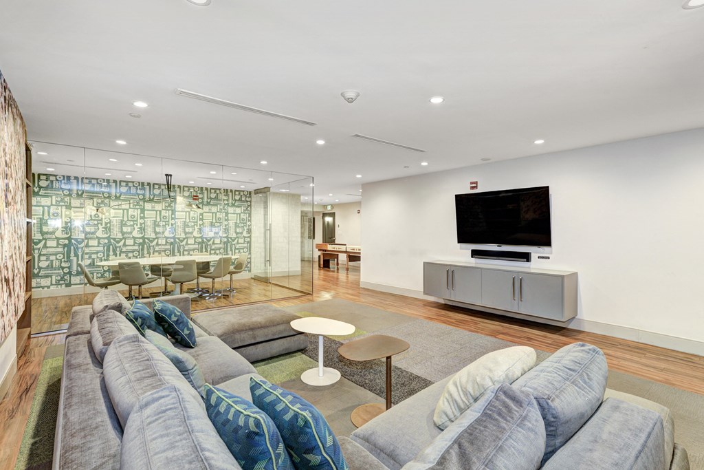 a living room filled with furniture and a flat screen tv