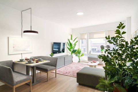 a rendering of a living room with a table and chairs