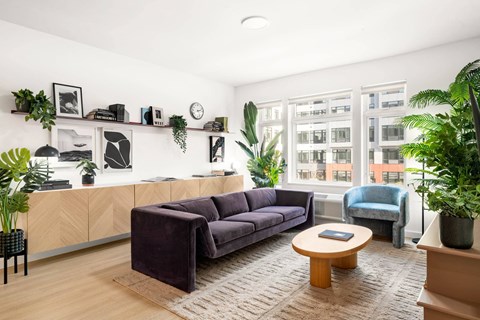 a living room with a couch and a large window
