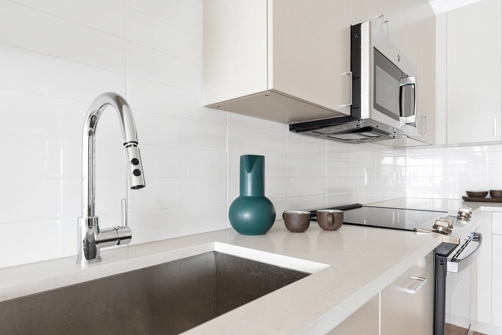 a kitchen with a sink and a faucet